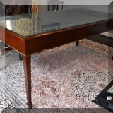 F30. Trosby Furniture of Sussex England leather topped executive desk. Molding on side broken and scratching from regular use. 30”h x 71”w x 36”d - $650
